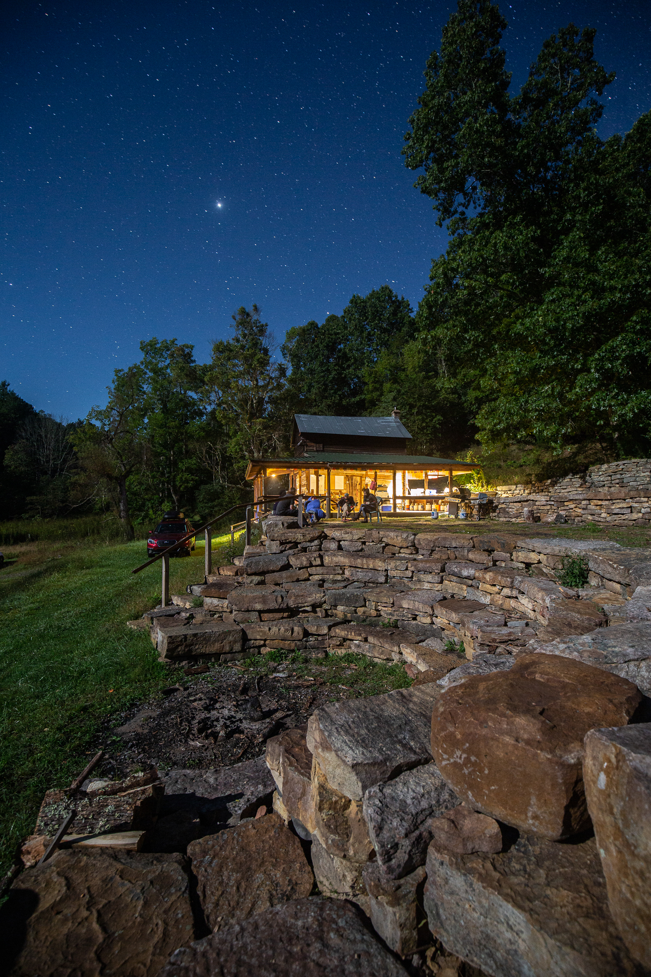 Nighttime view of the BCCS Homestead under a starry sky